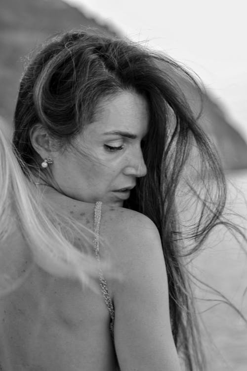 Grayscale Photography of Woman Wearing Backless Top