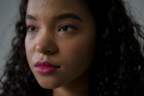 Free A Pretty Girl with Curly Hair in Close-up photography Stock Photo