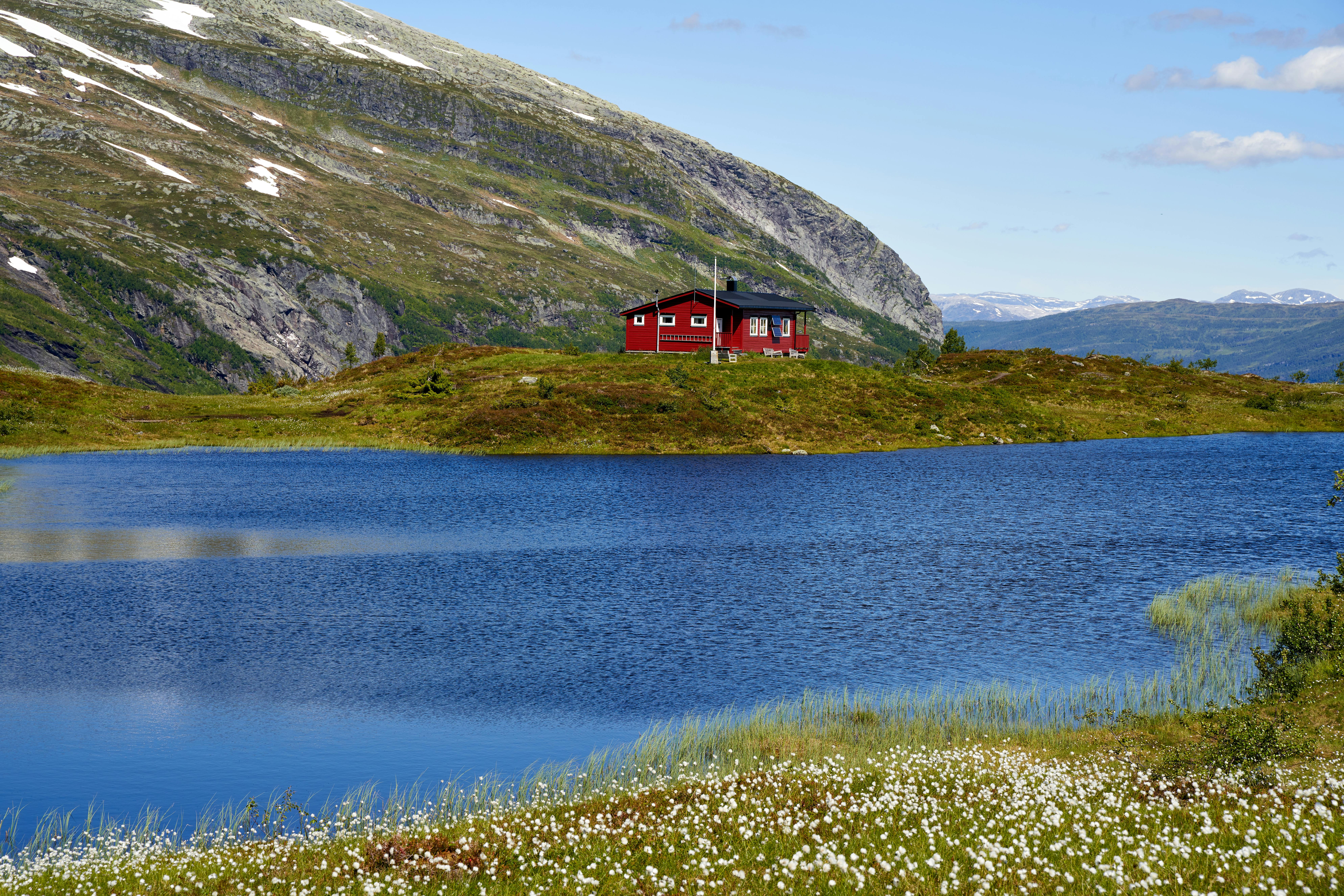 Free Red and Black House Near Lake and Mountain Stock Photo