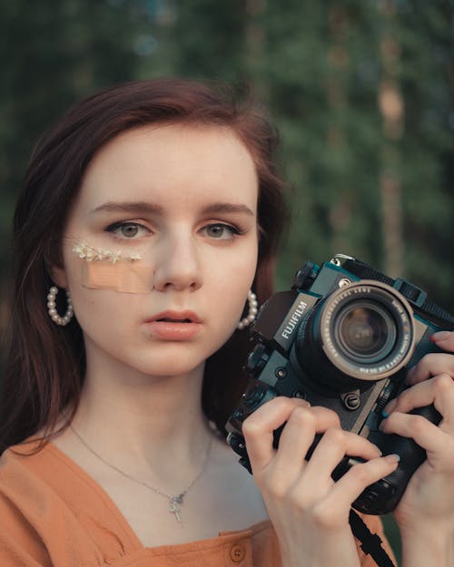 Portrait of Photographer Holding Camera