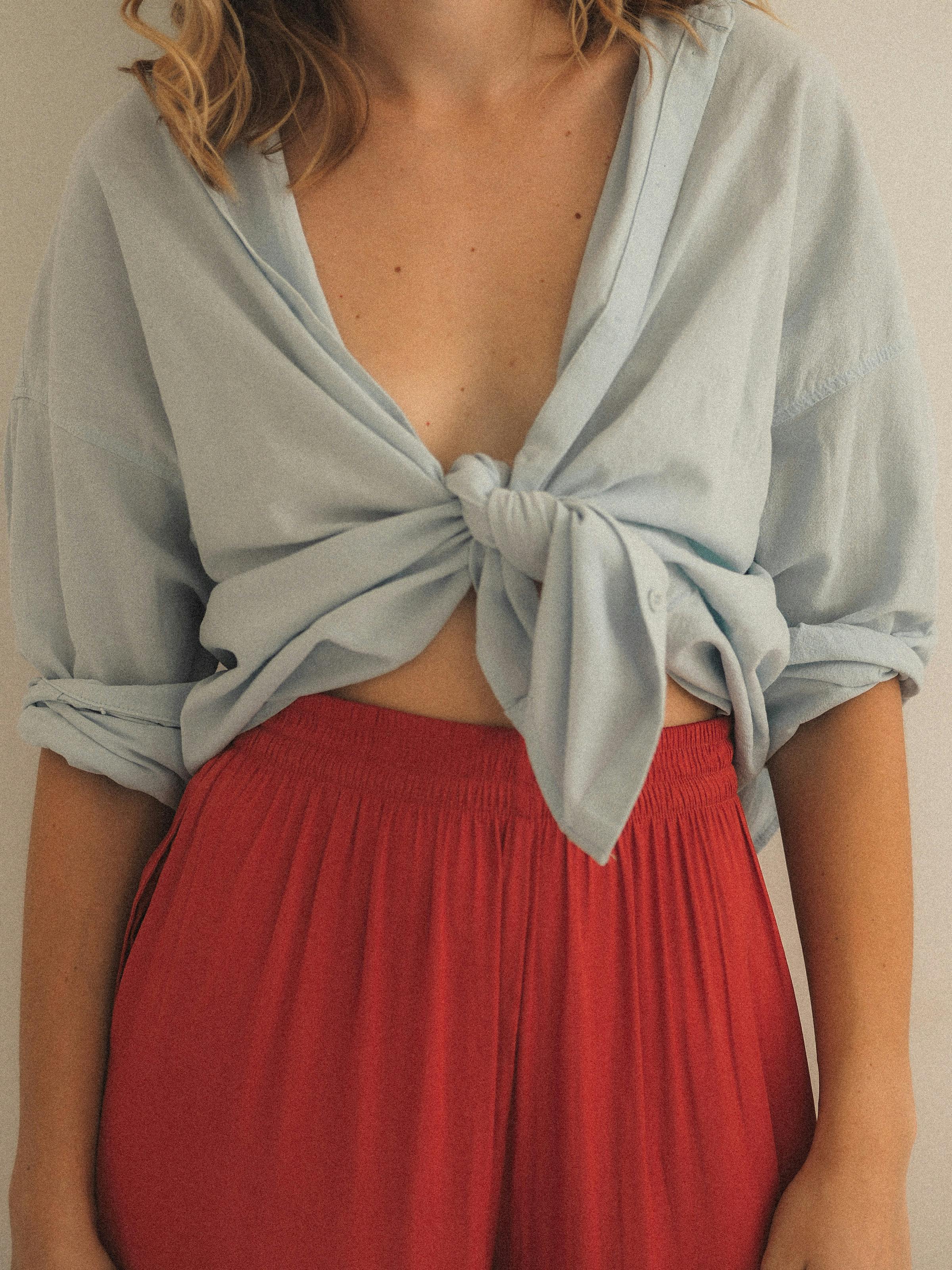 Woman in Blue Top and Red Skirt · Free Stock Photo