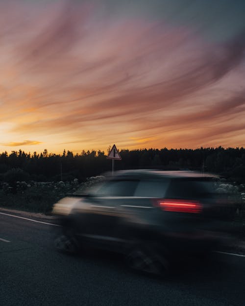 Black Car on Road During Sunset