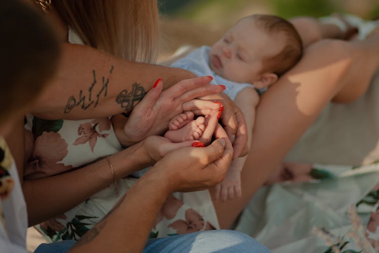 Couple Holding Baby Feet