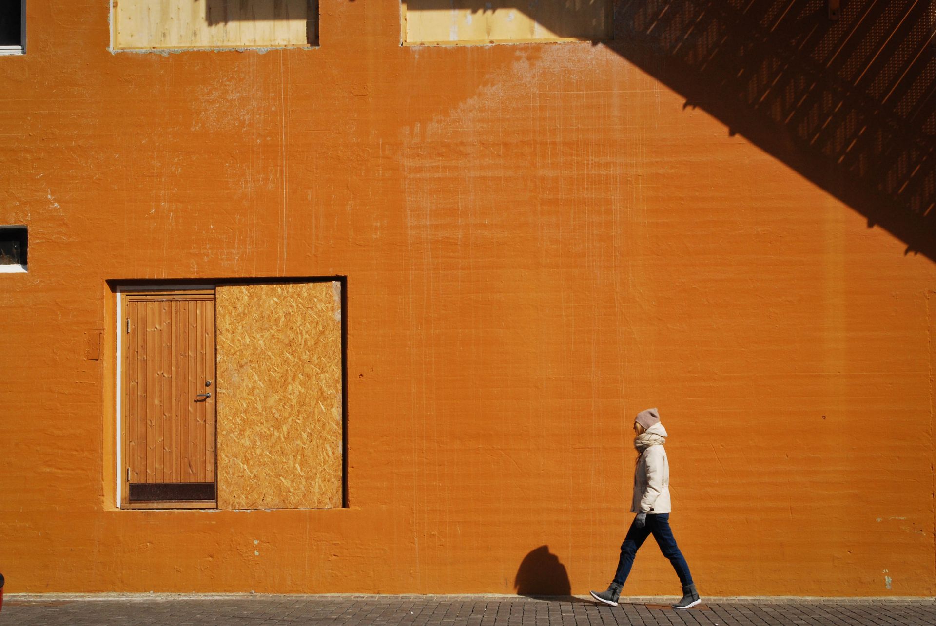 Person Walking on Sidewalk