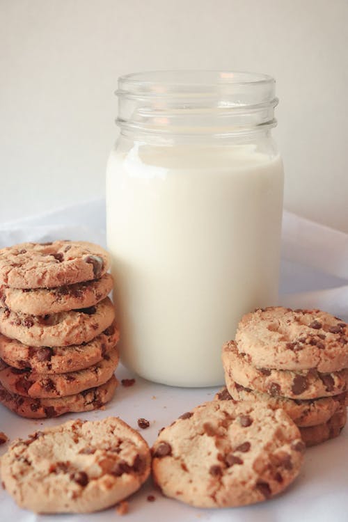 Free Cookies Beside Glass Jar With Milk Stock Photo