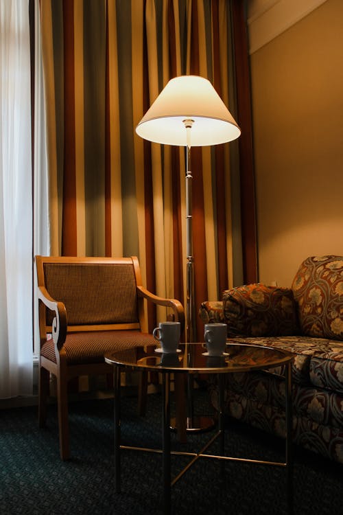 Floor Lamp Near Chairs and a Coffee Table