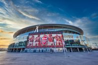 Red and White Stadium Under Blue Sky