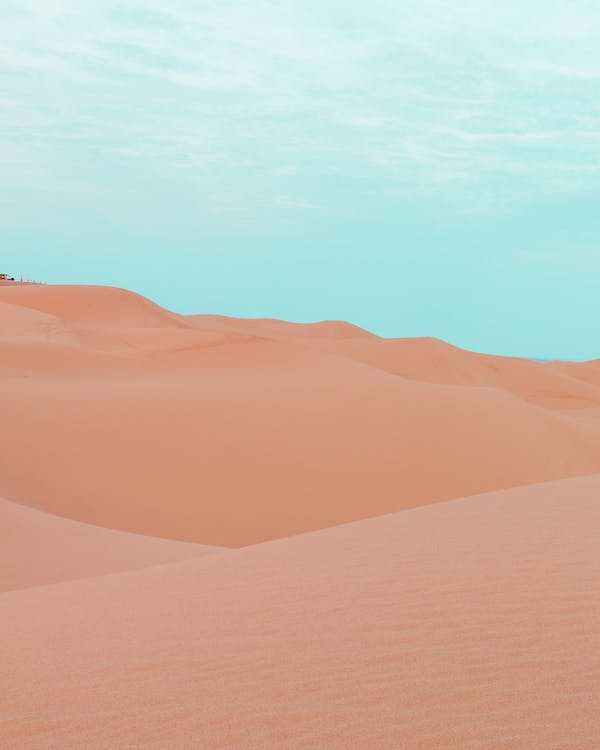 Photo of a Desert Under a Blue Sky