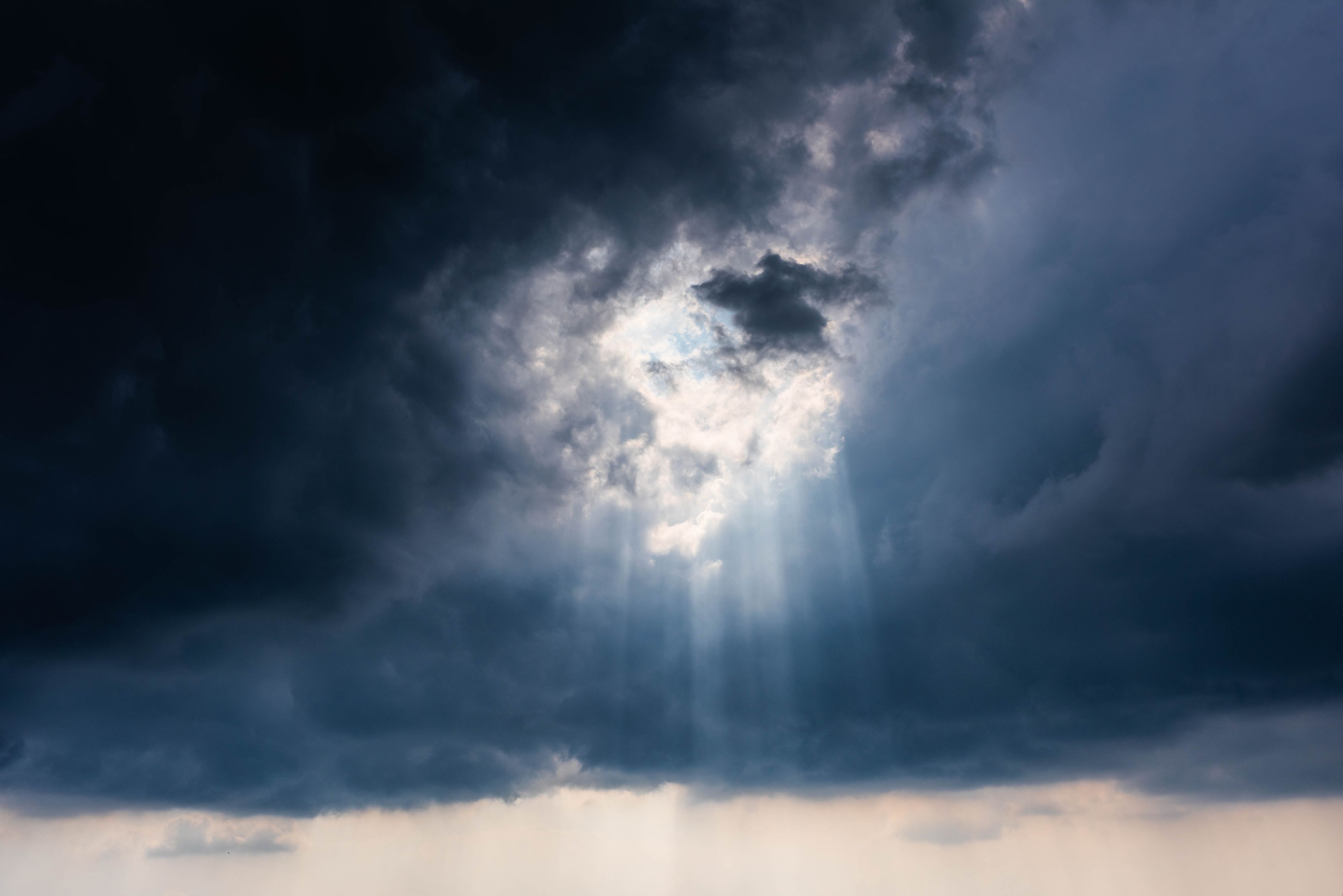 Light breaking through dark clouds