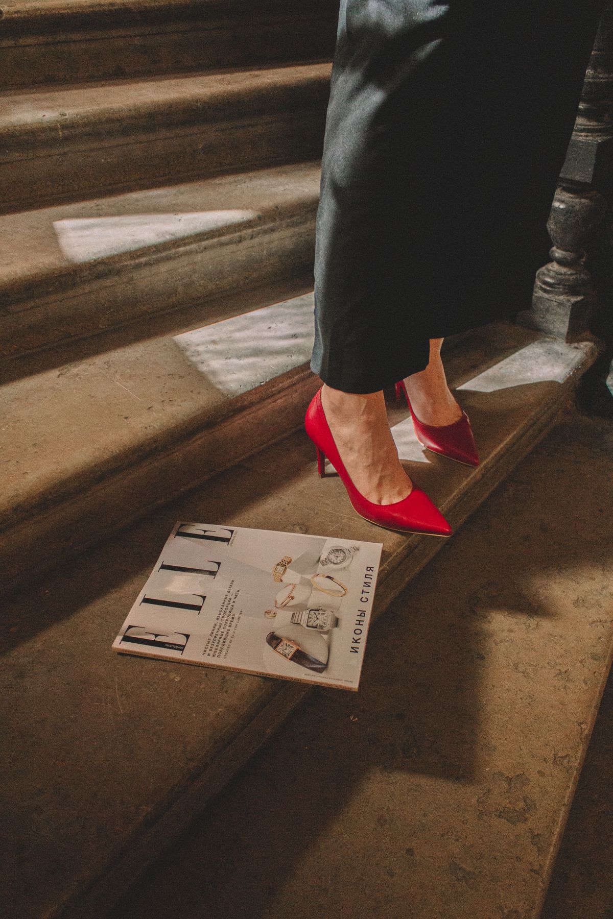 Red heels on concrete stairs — the return of the stiletto