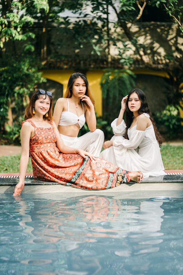 Asian Women Near Swimming Pool