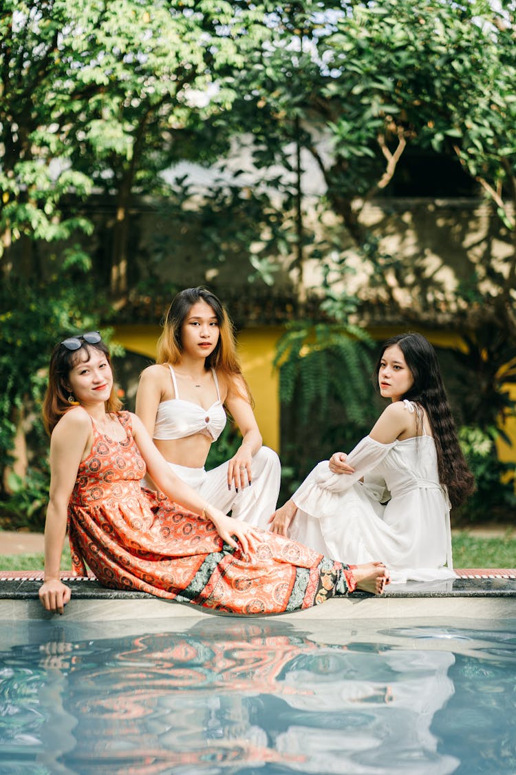 Asian Women Near Swimming Pool