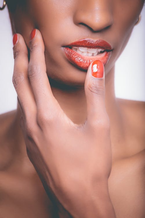 Woman With Red Lipstick and Red Manicure