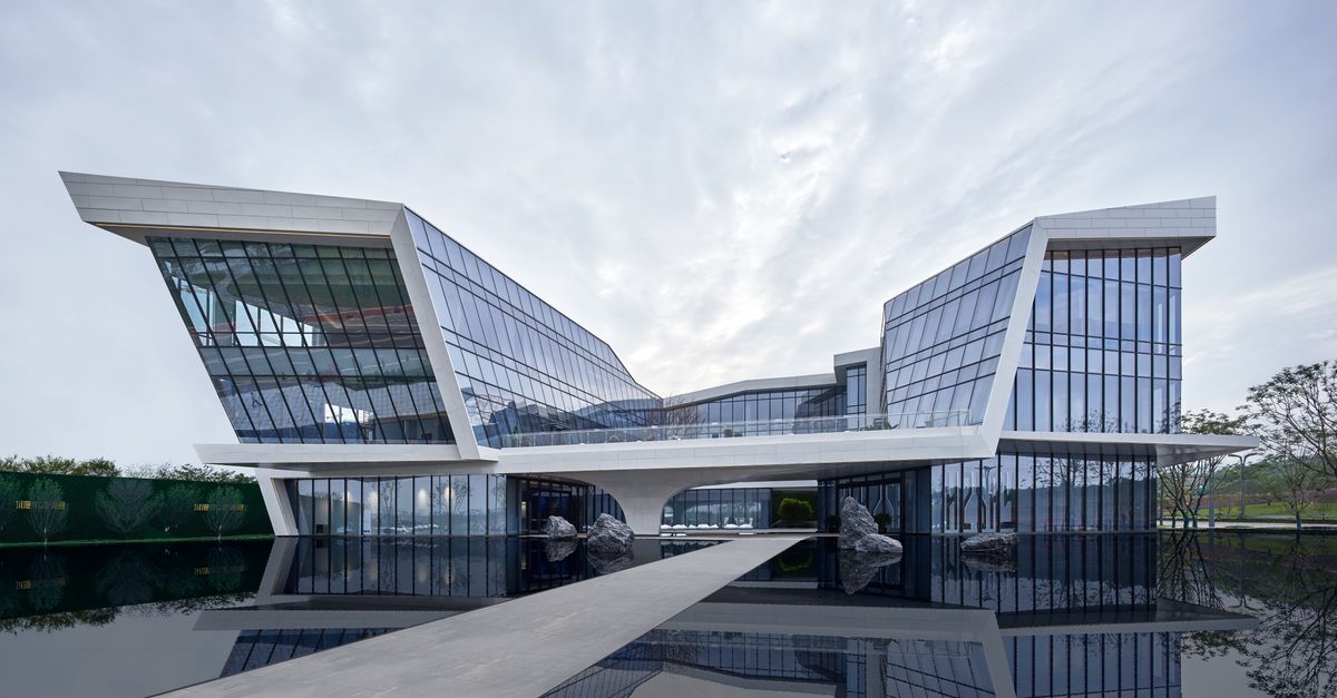 Contemporary building with reflective glass facade in Sichuan blending nature and innovation.