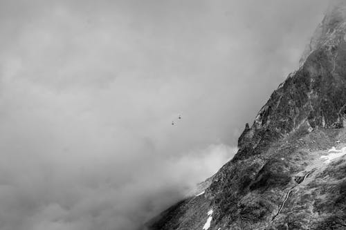 Grayscale Photo of Rocky Mountainside