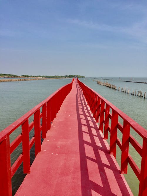 Free Red Wooden Dock on Sea Stock Photo