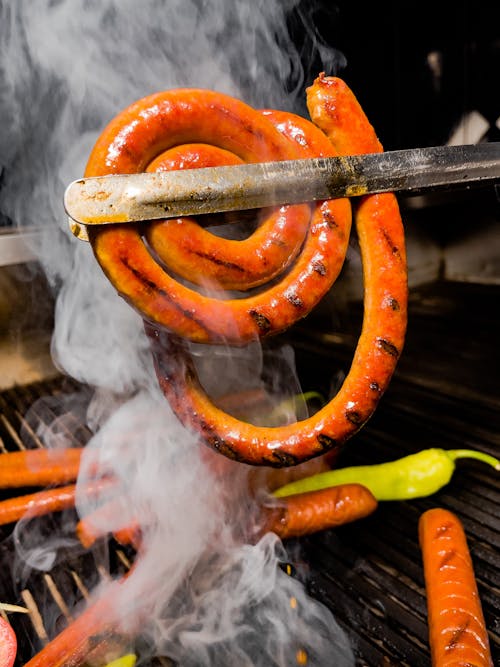 Close Up Photo of Grilling of Sausage
