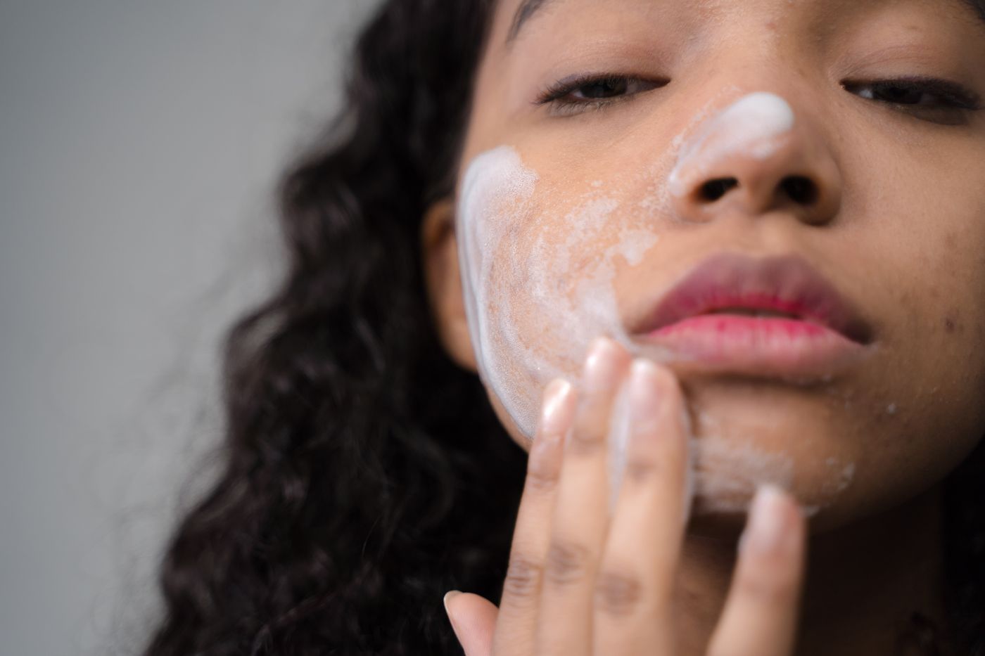Illustrative close-up showing healthy-looking skin and skincare application