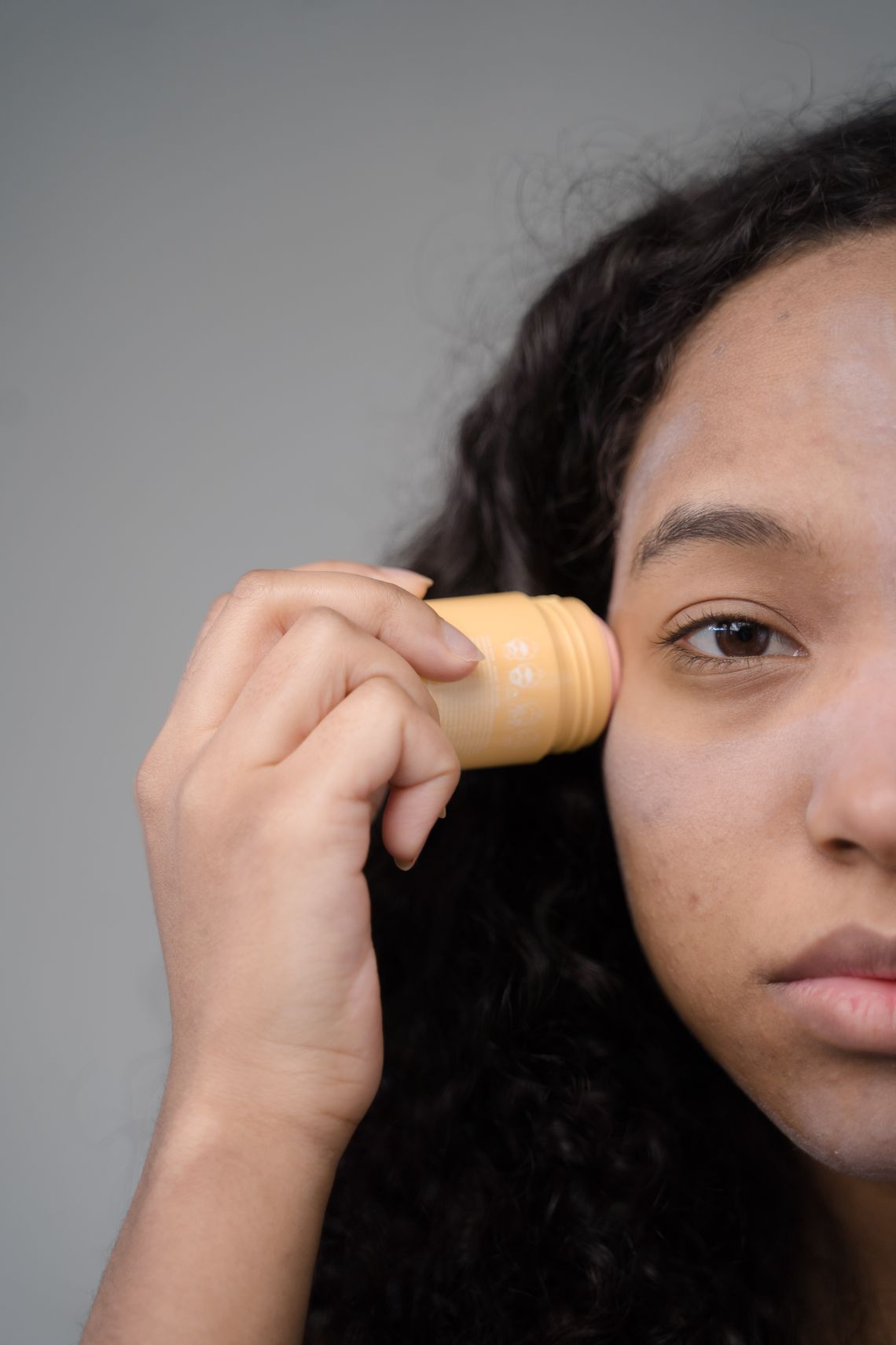 Woman completing a calm facial skincare routine