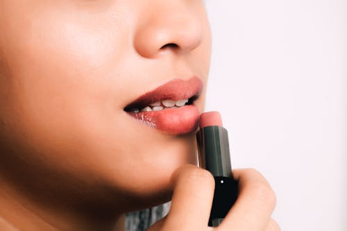 Woman Using Pink Lipstick