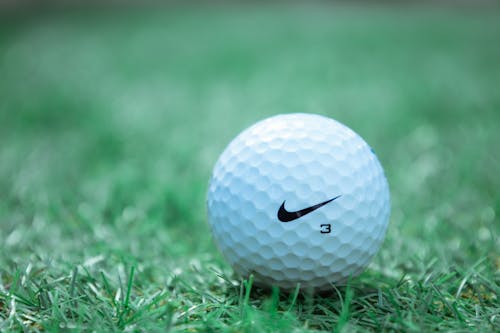 White Golf Ball on Green Grass