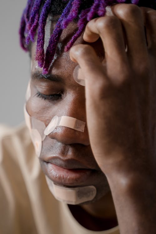 Close Up Photo of Man with Bandages on his Face