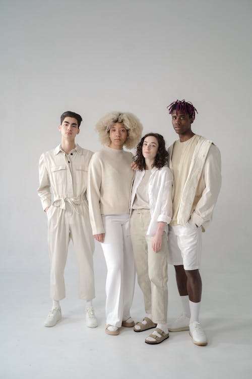 Group of People in Beige and White Outfits