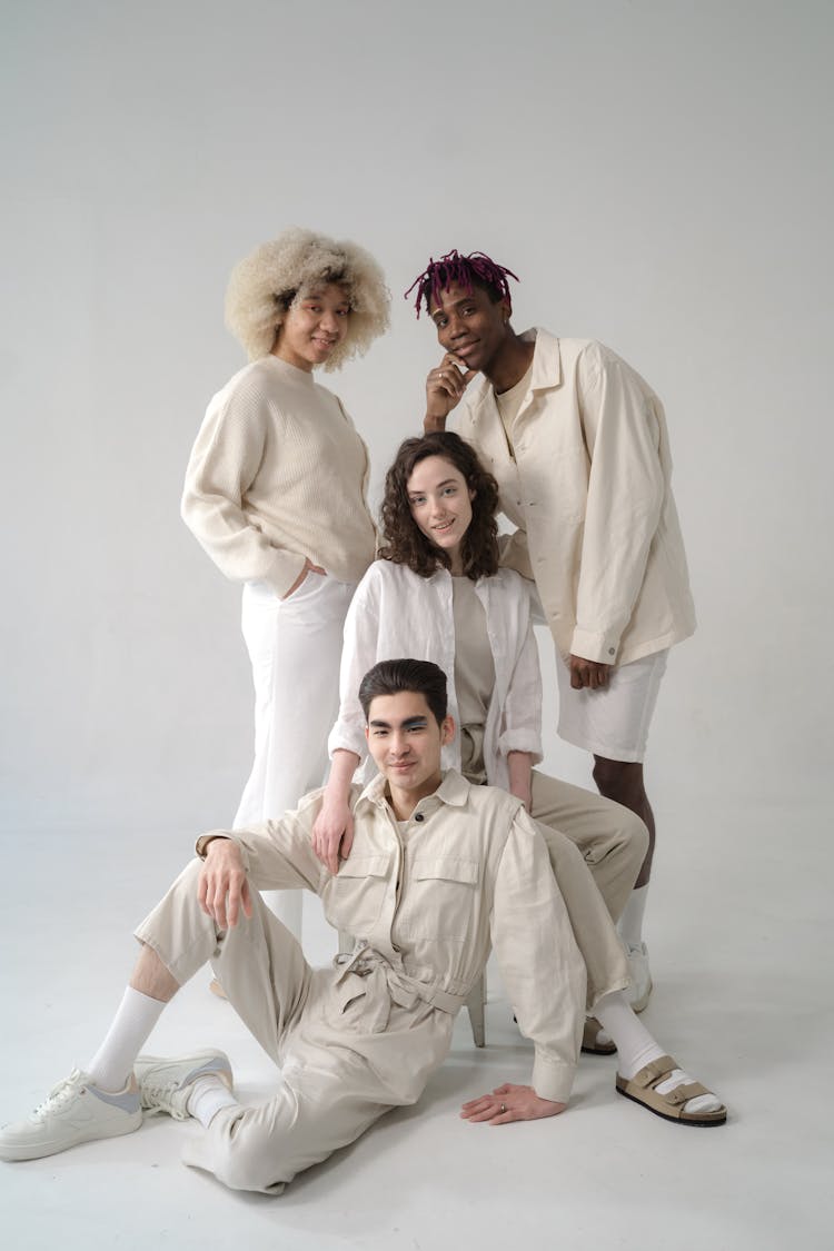 Men And Women In Beige And White Outfits