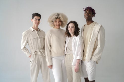 Group of People in Beige and White Outfits · Free Stock Photo