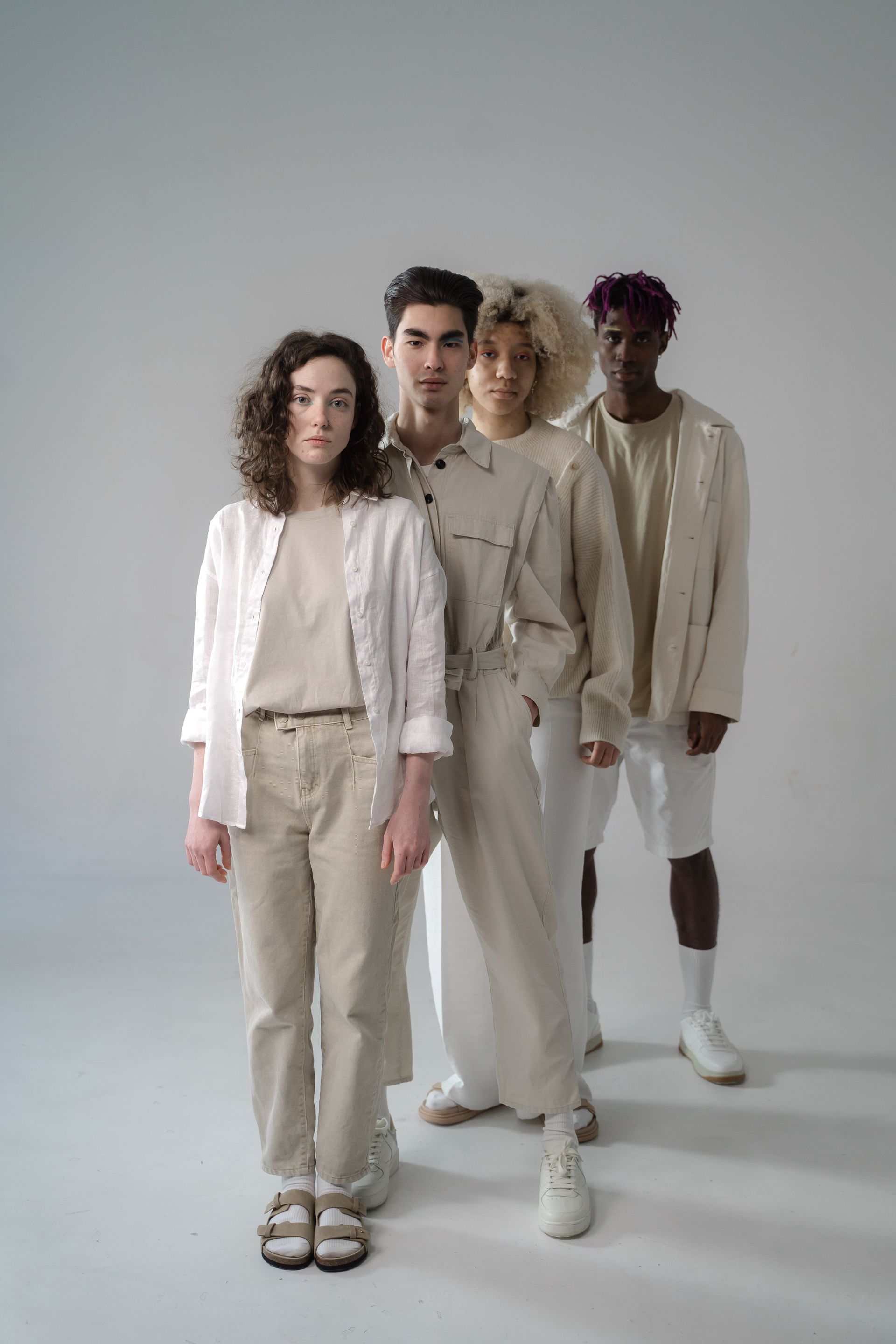 Editorial fashion scene with women in neutral tones