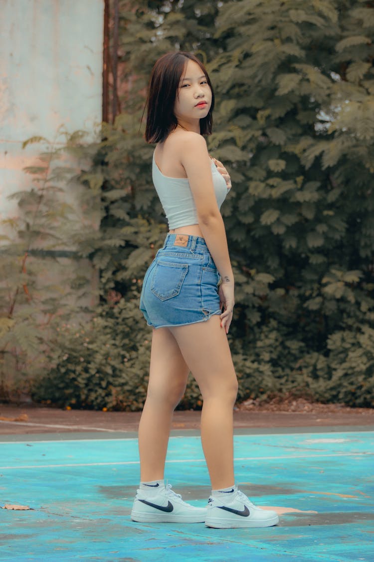 Woman Posing In Jeans Shorts