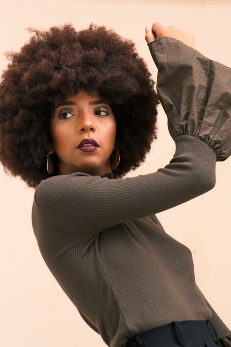 Woman Posing On Studio Background