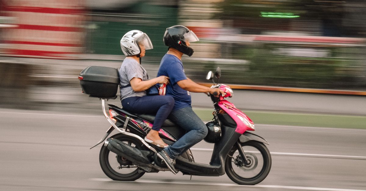 Two People Riding a Motor Scooter · Free Stock Photo