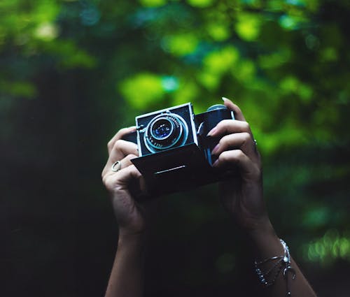 Free Close-Up Shot of a Person Holding an Analog Camera Stock Photo
