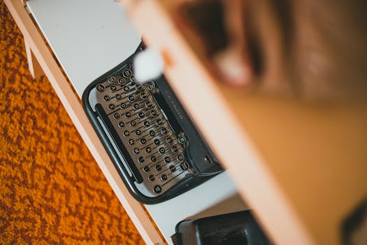 Overhead view of a vintage typewriter on a retro-style desk, evoking nostalgia.