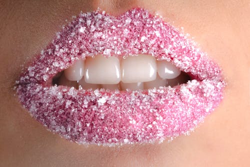 Free White Granules on Person Lips Stock Photo
