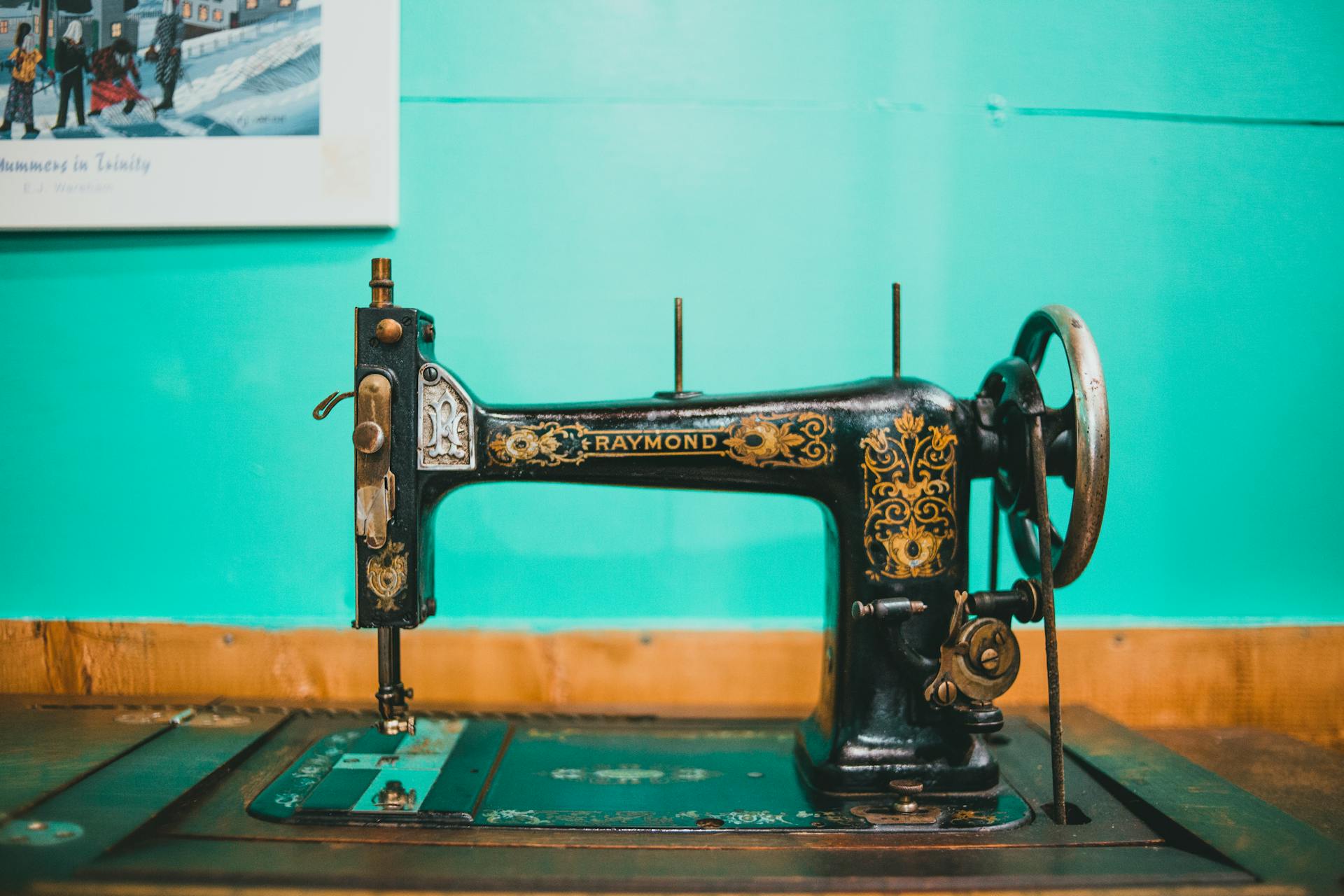 A classic Raymond sewing machine in a vibrant retro setting, perfect for vintage enthusiasts.