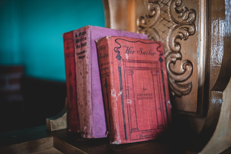 Vintage Purple Books On A Shelve