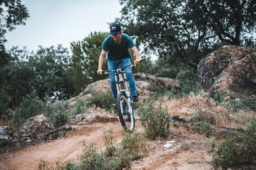 Man Riding a Mountain Bike on a Trail