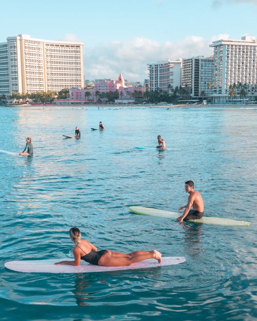 People Surfing on the Beach