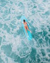 Woman in Red Bikini Swimming on Pool