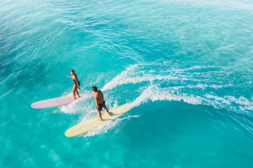 A Man and a Woman Surfing 