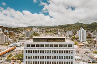 White Concrete Building Under Blue Sky