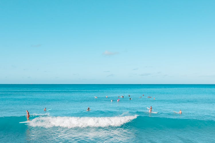 People Enjoying Blue Sea