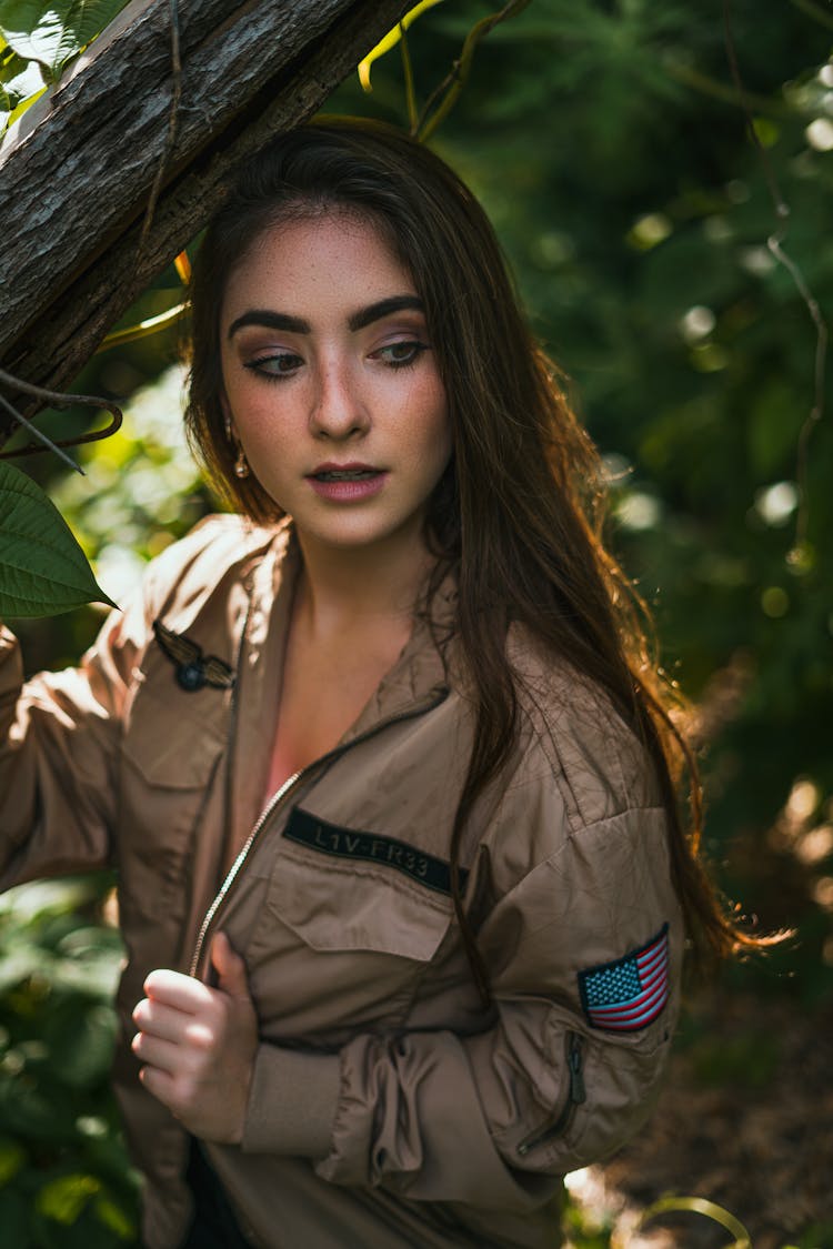 A Woman Wearing A Military Jacket