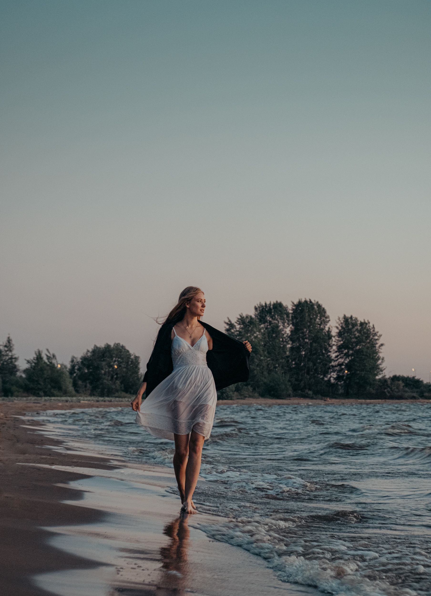 A Woman in White Dress Walking on the Beach · Free Stock Photo