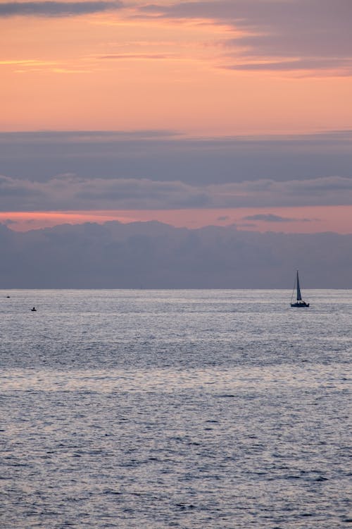 Free Sailboat on the Sea during Sunset Stock Photo