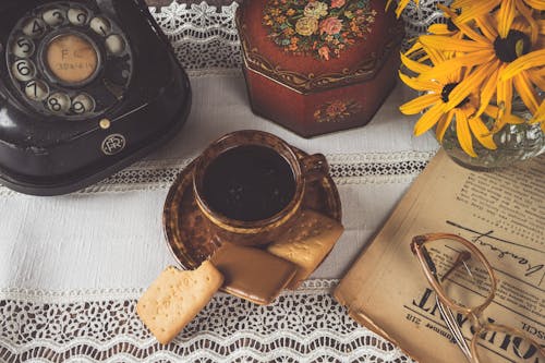 Coffee in Cup and Cookies on Saucer