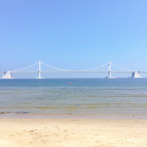 Free A White Bridge over the Beach Stock Photo