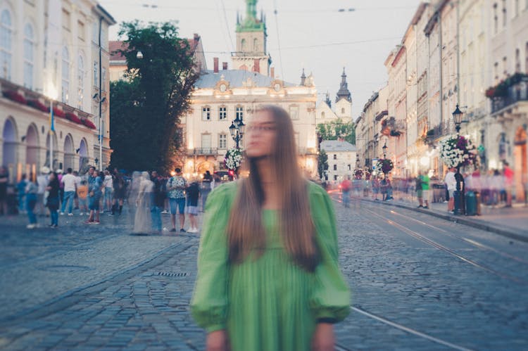Blurred Portrait Of Woman On Old Town Square
